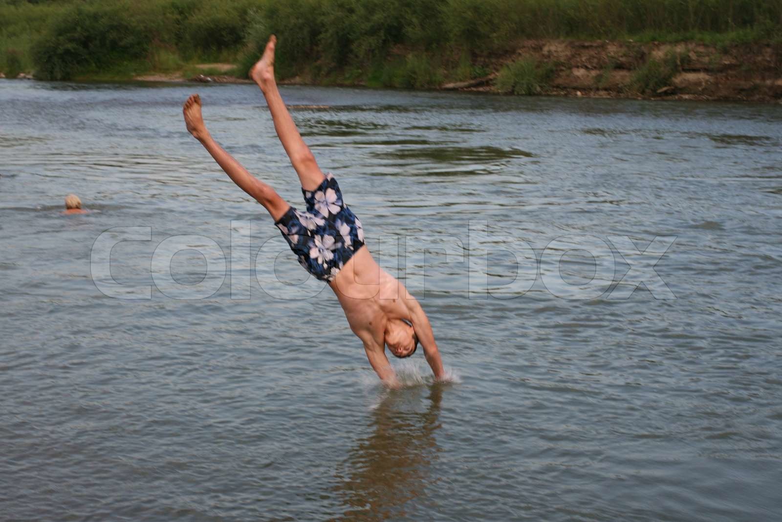 People swim in the river Stock image Colourbox