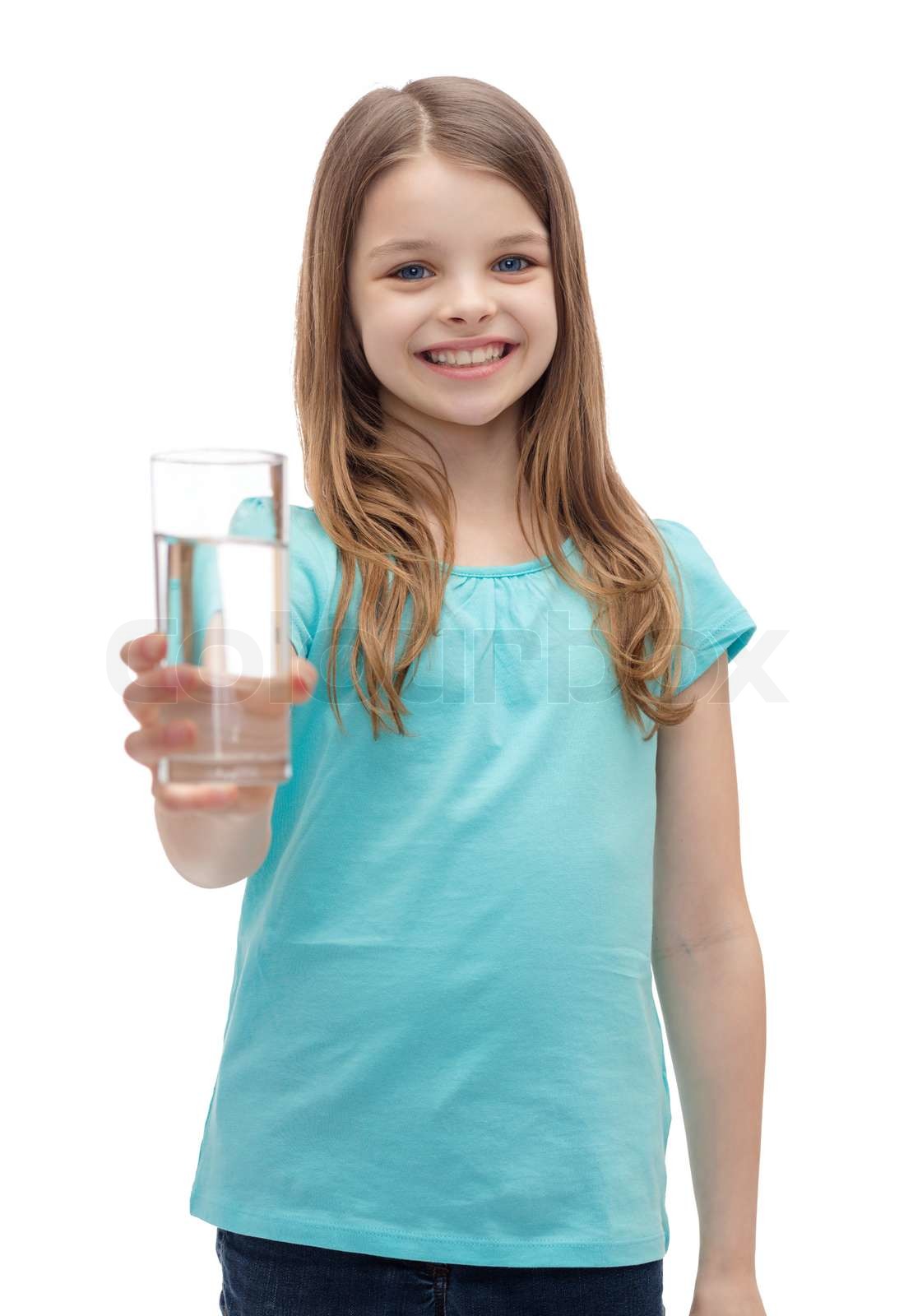 smiling little girl giving glass of water | Stock image | Colourbox