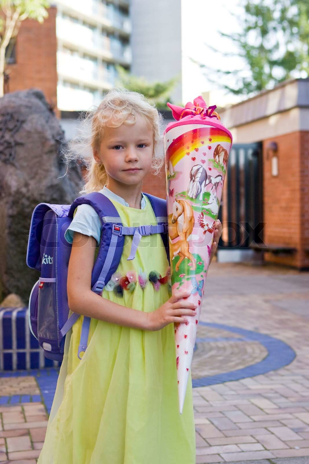 a-young-girl-holding-a-cone-of-candies-on-her-first-day-of-school