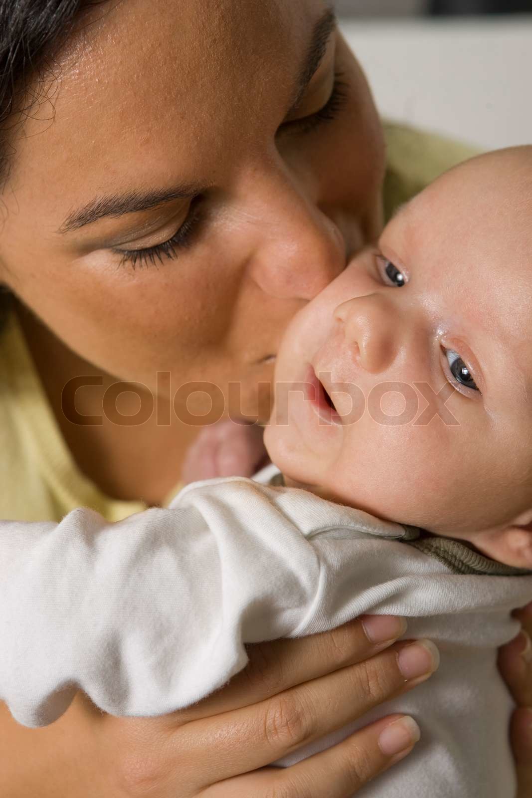 A Mother Kissing Her Cute Baby Stock Image Colourbox