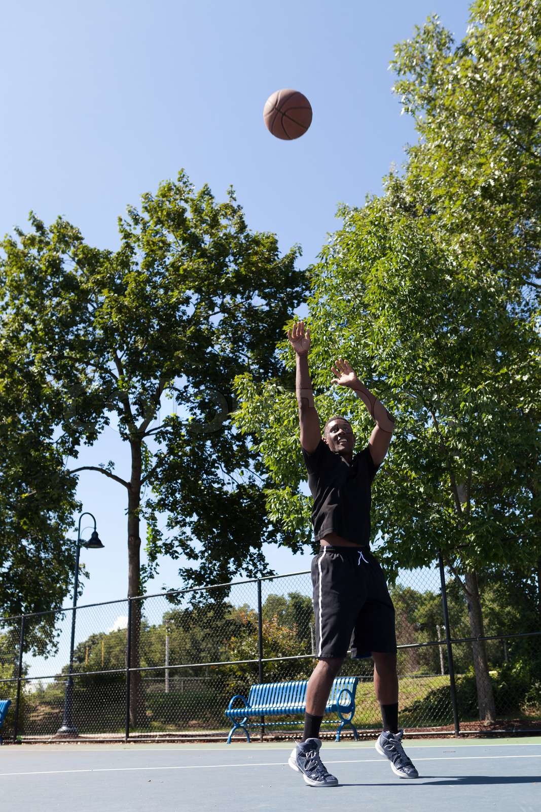 Basketball Player Shooting | Stock image | Colourbox