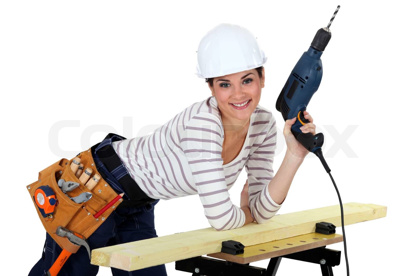 Frau mit einer Bohrmaschine Stock Bild Colourbox