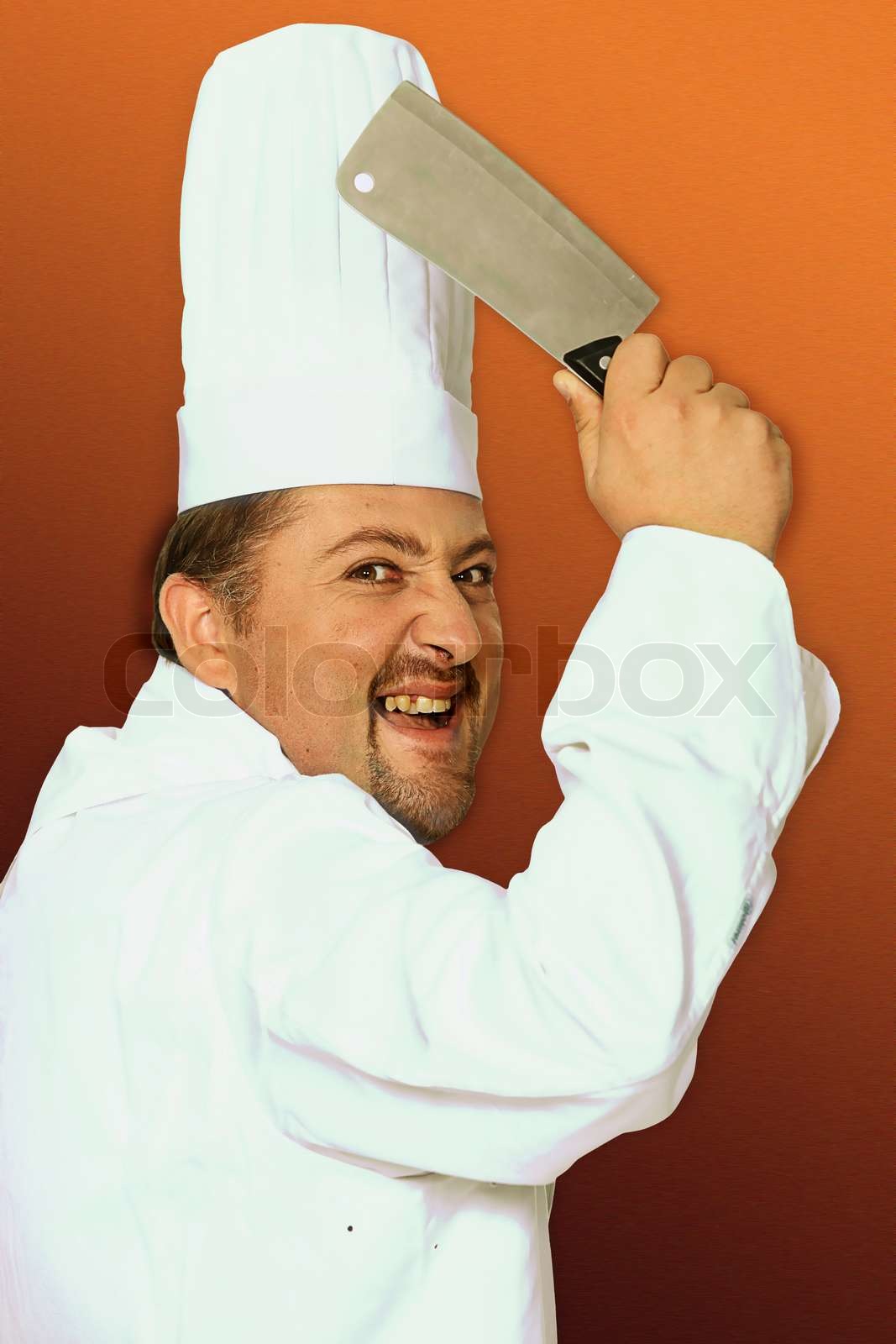 Menacing butcher holding meat cleaver Stock image Colourbox