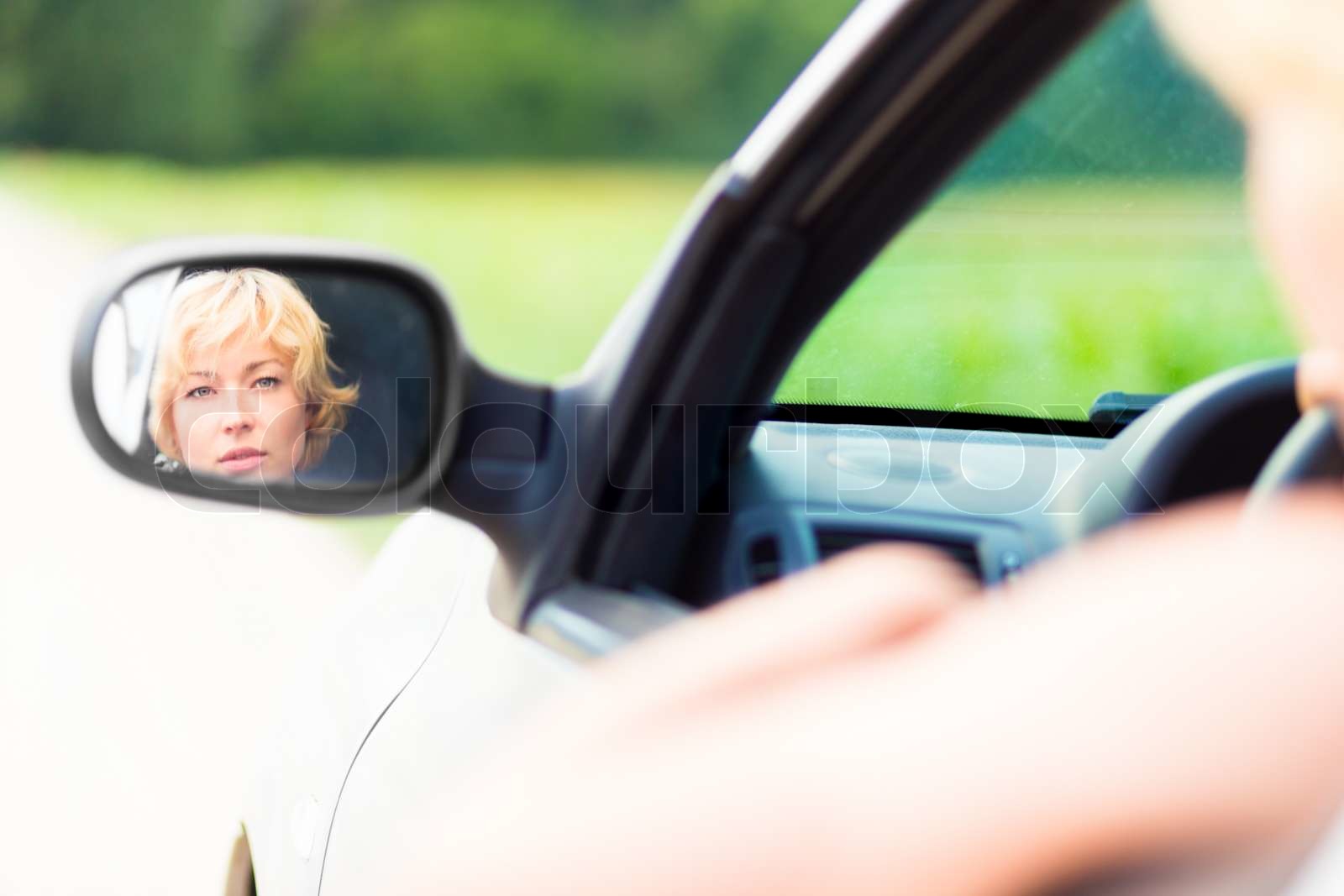 Lady driving a car. | Stock image | Colourbox
