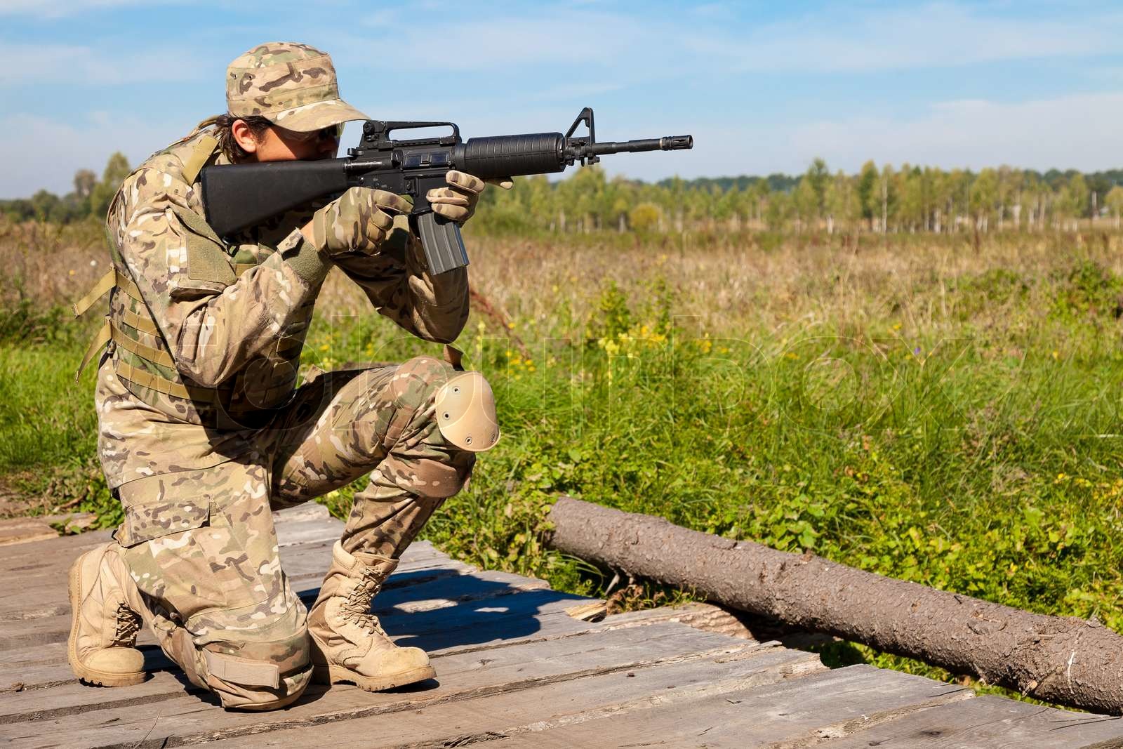 Soldier with a rifle | Stock image | Colourbox