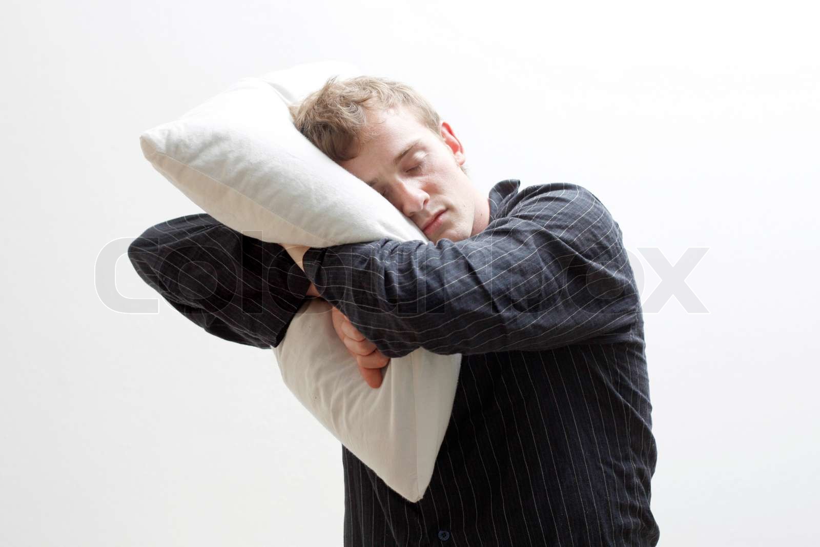 man holding pillow