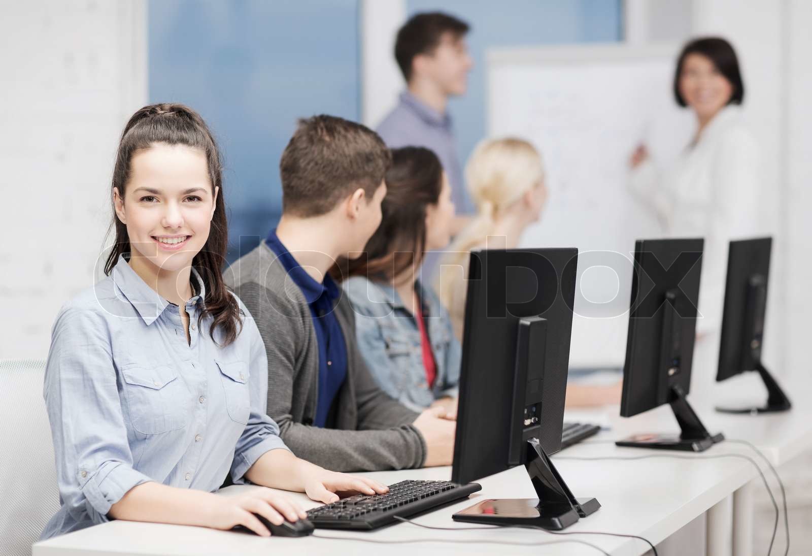 students with computer monitor at school | Stock image | Colourbox