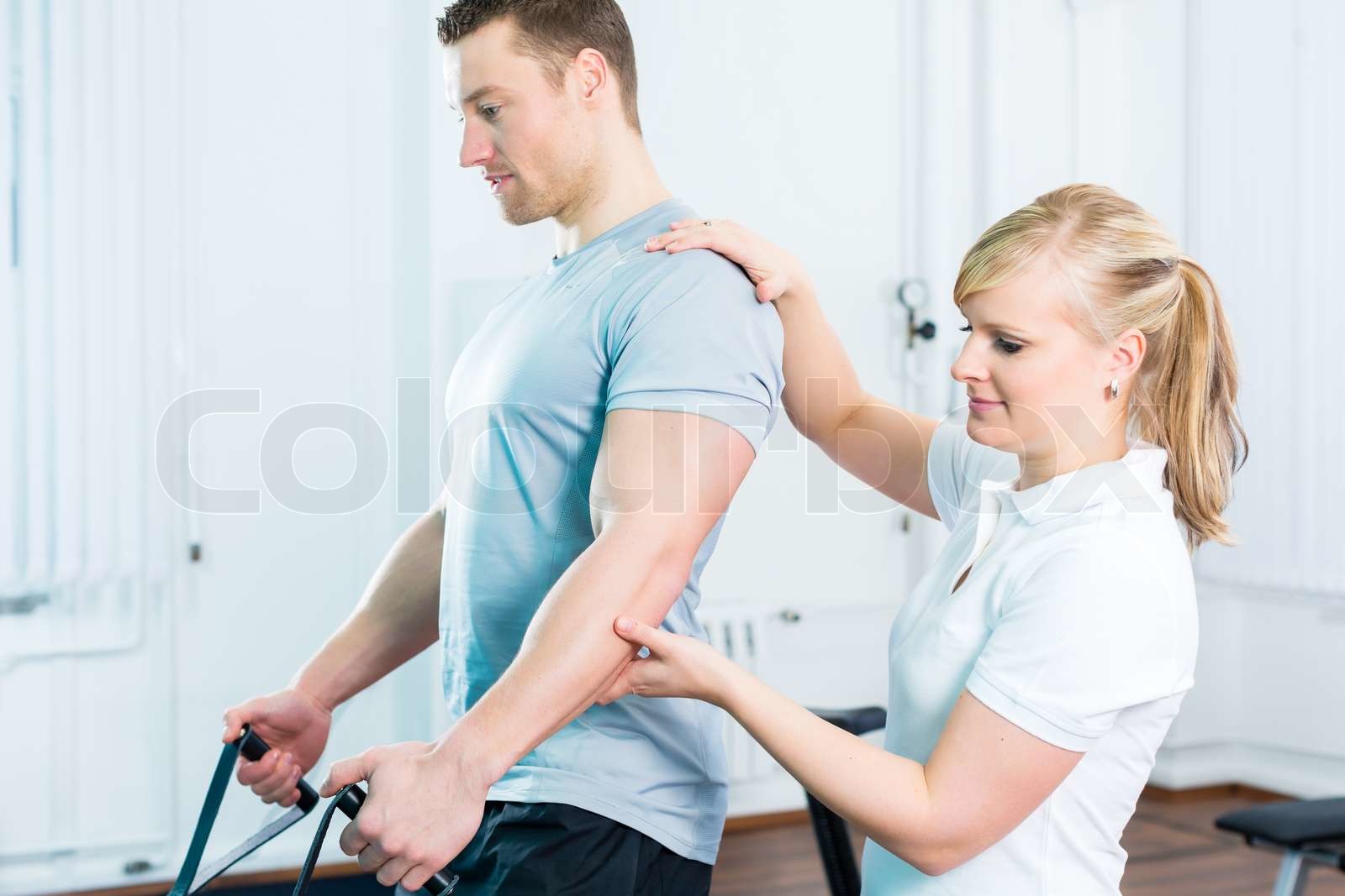 Physiotherapist excercising patient in practice Stock image Colourbox