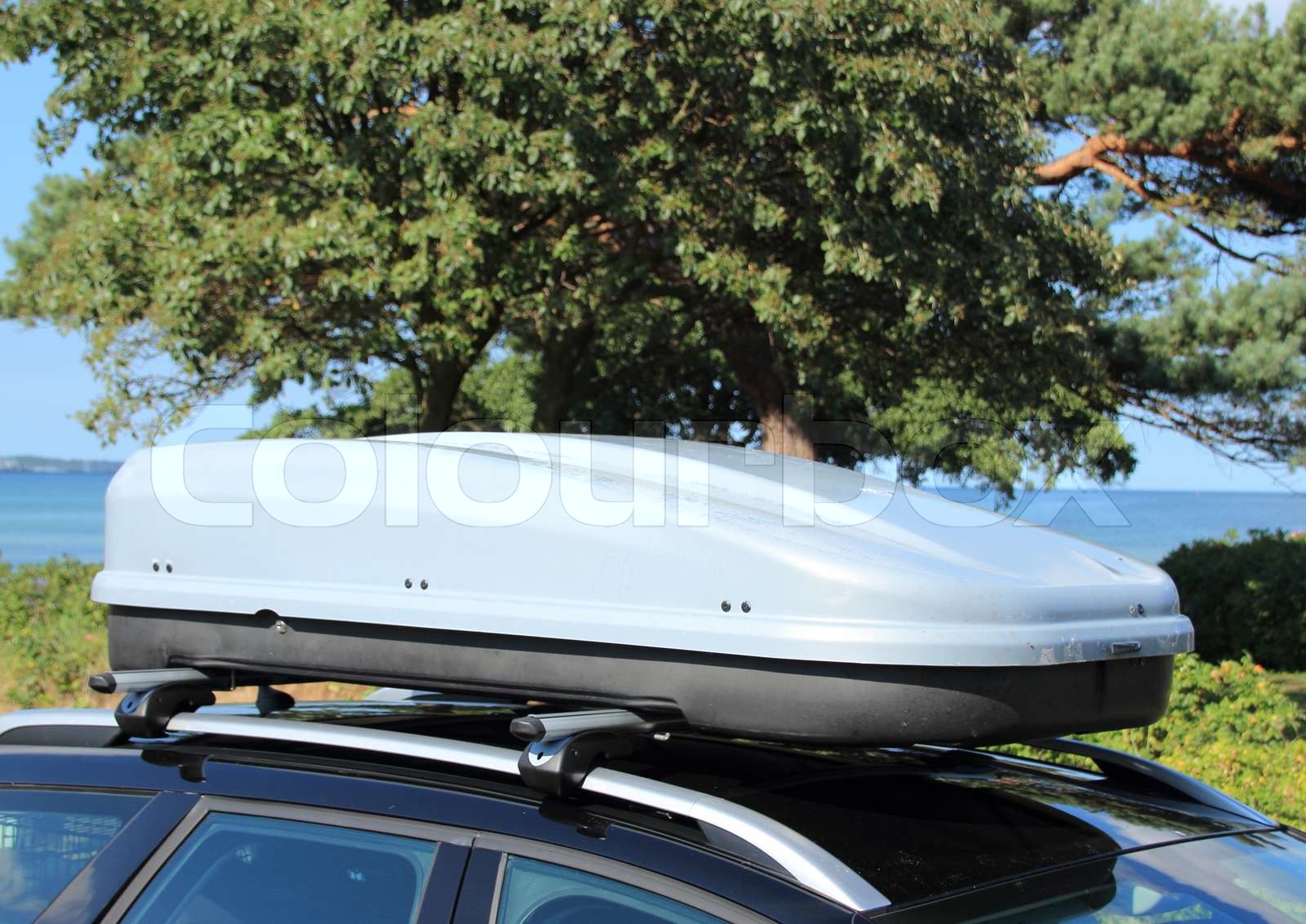 Roof box on car with railing Stock image Colourbox
