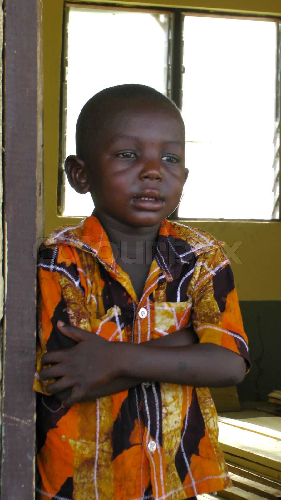 A Poor Little Boy Standing In The Doorway Stock Image Colourbox
