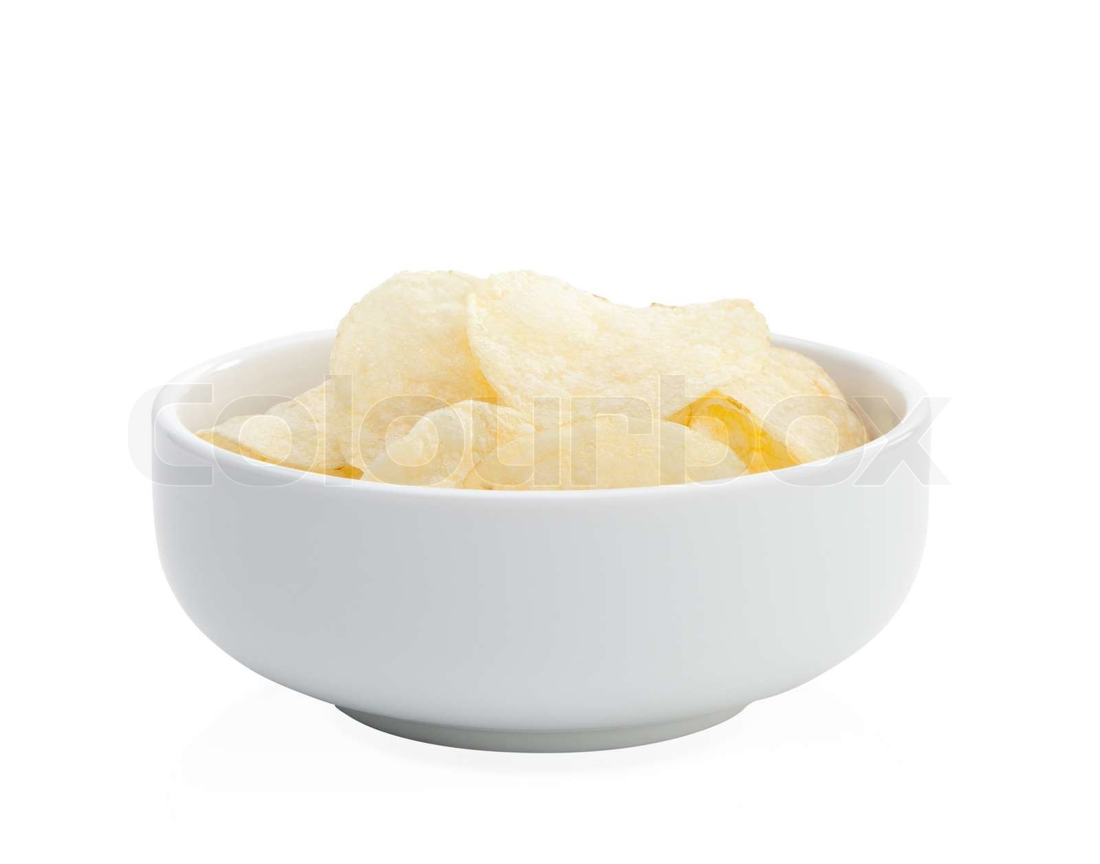 Slice potato chips arranges in a bowl isolated Stock image Colourbox