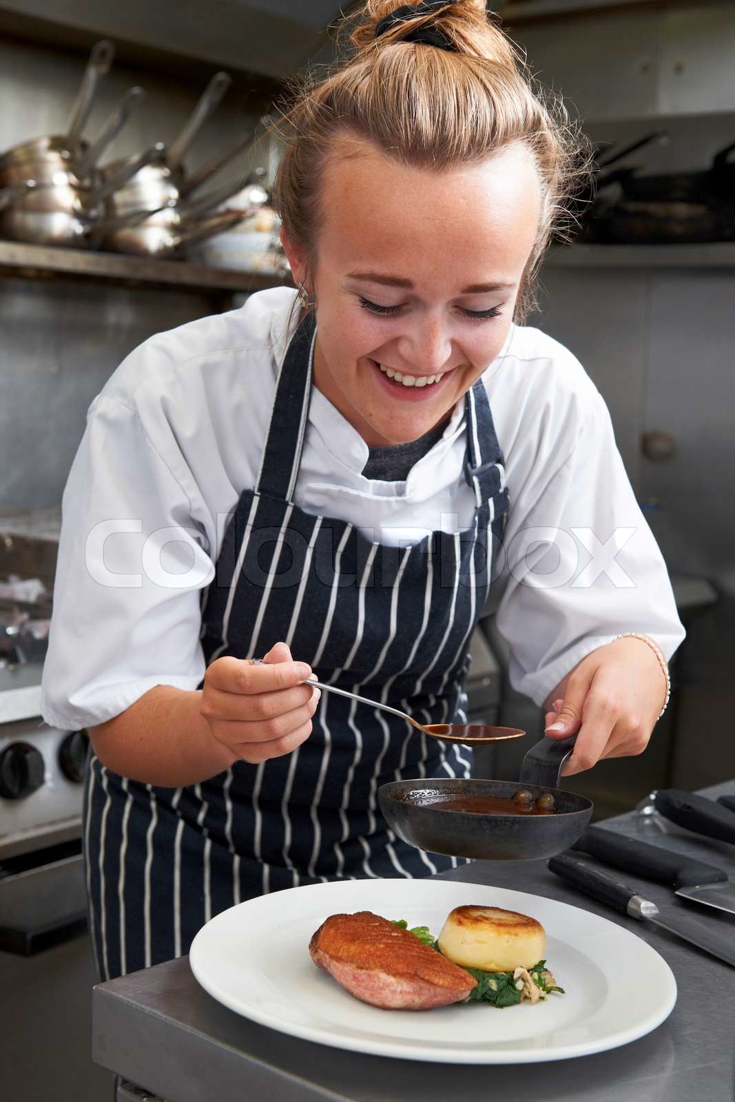 Trainee Chef Working In Restaurant Kitchen | Stock image | Colourbox