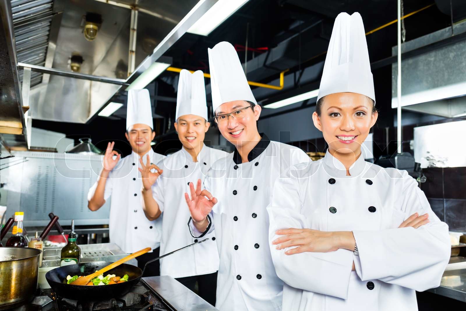 Asian Chefs in hotel restaurant kitchen | Stock image | Colourbox