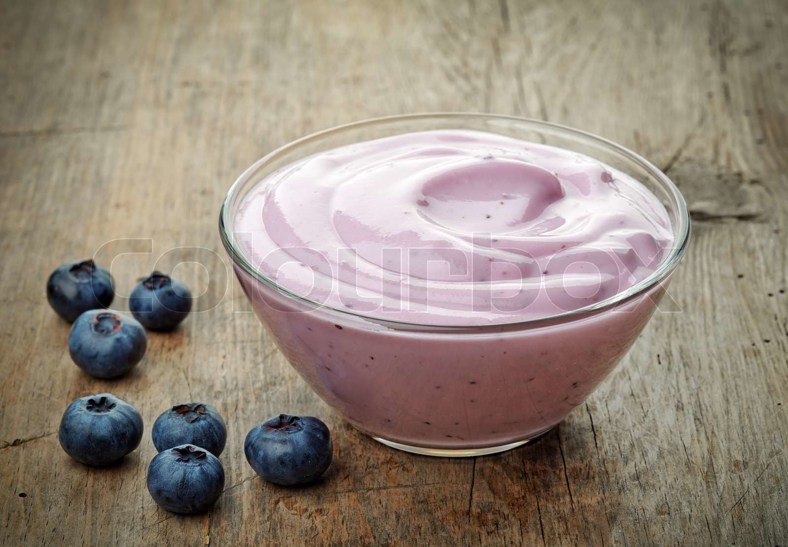 bowl of blueberry yogurt Stock image Colourbox