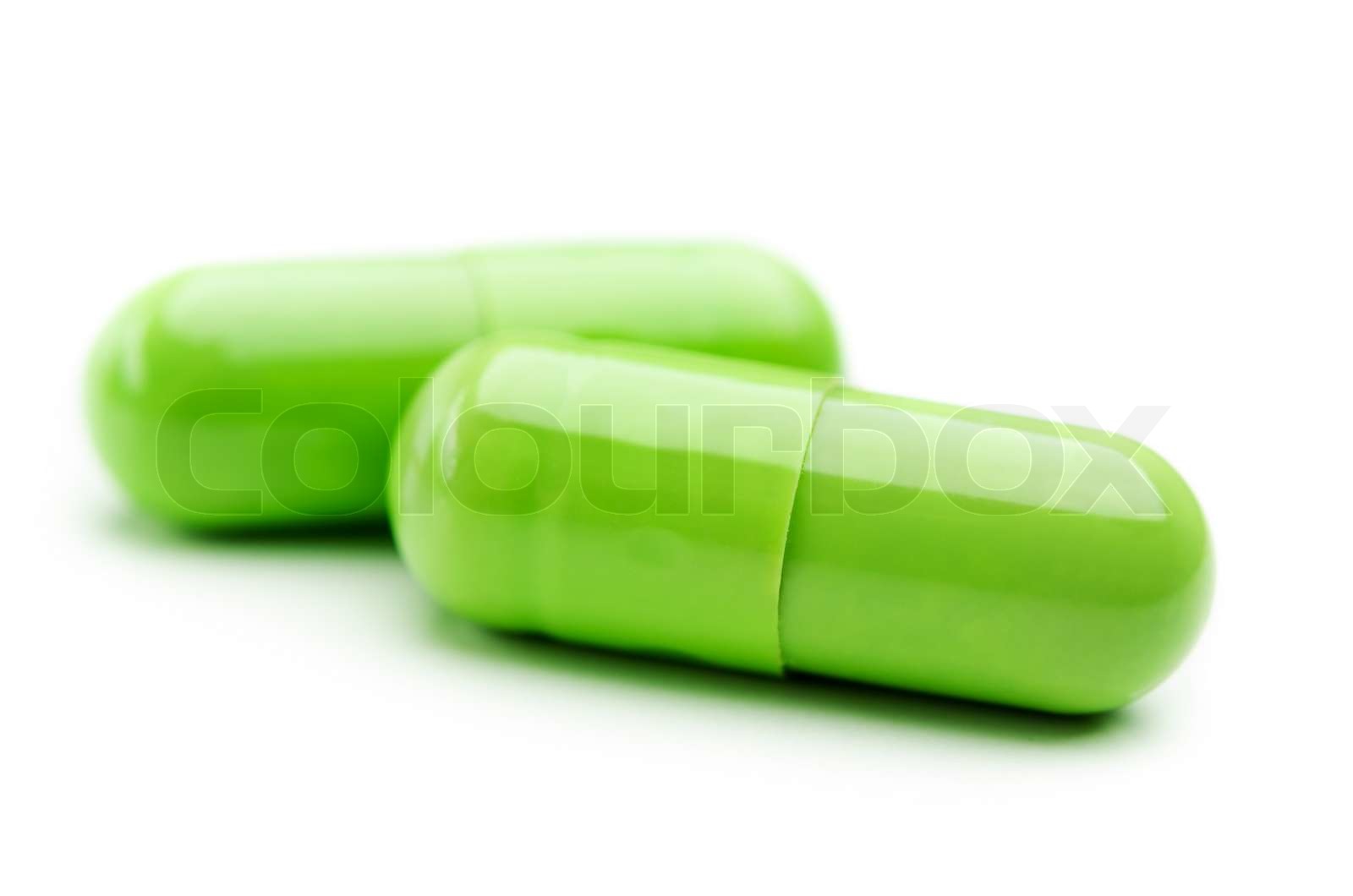 two green capsule isolated Stock image Colourbox