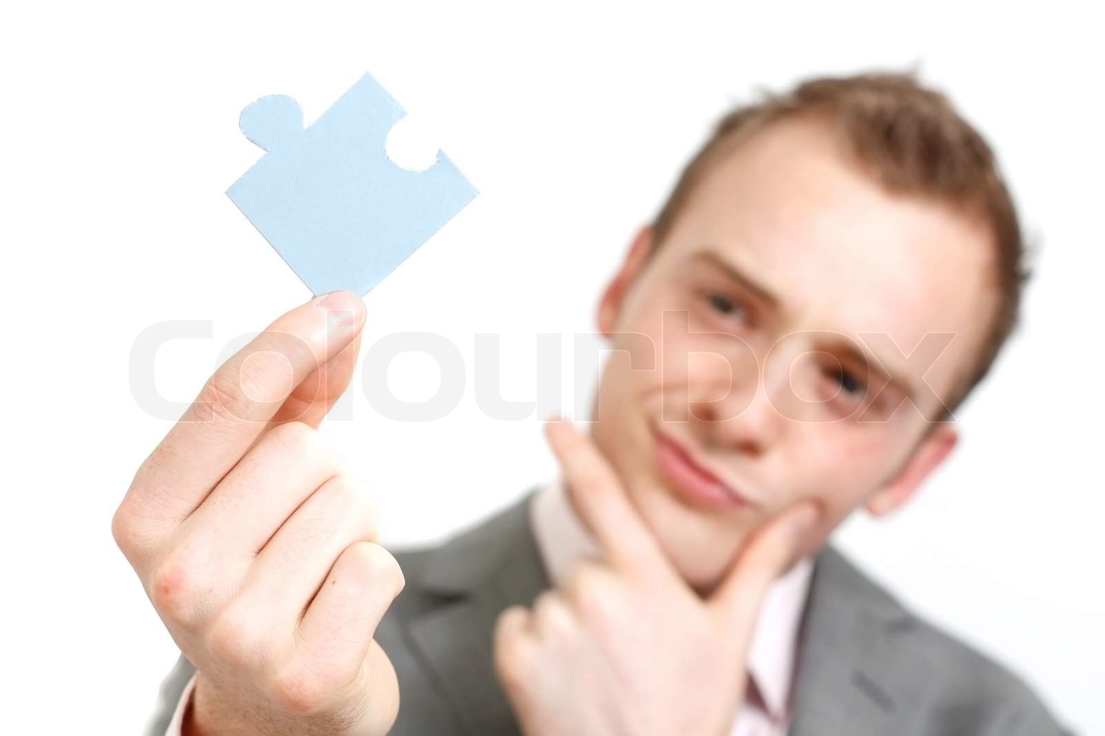 person solving a crossword puzzle