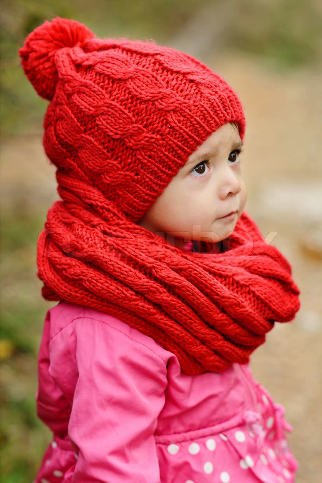 girl wearing red scarf and hat | Stock 