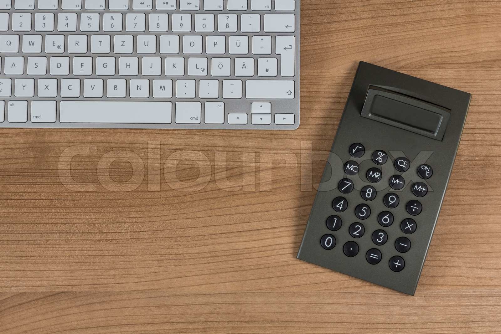 Keyboard and calculator on Desktop Stock image Colourbox