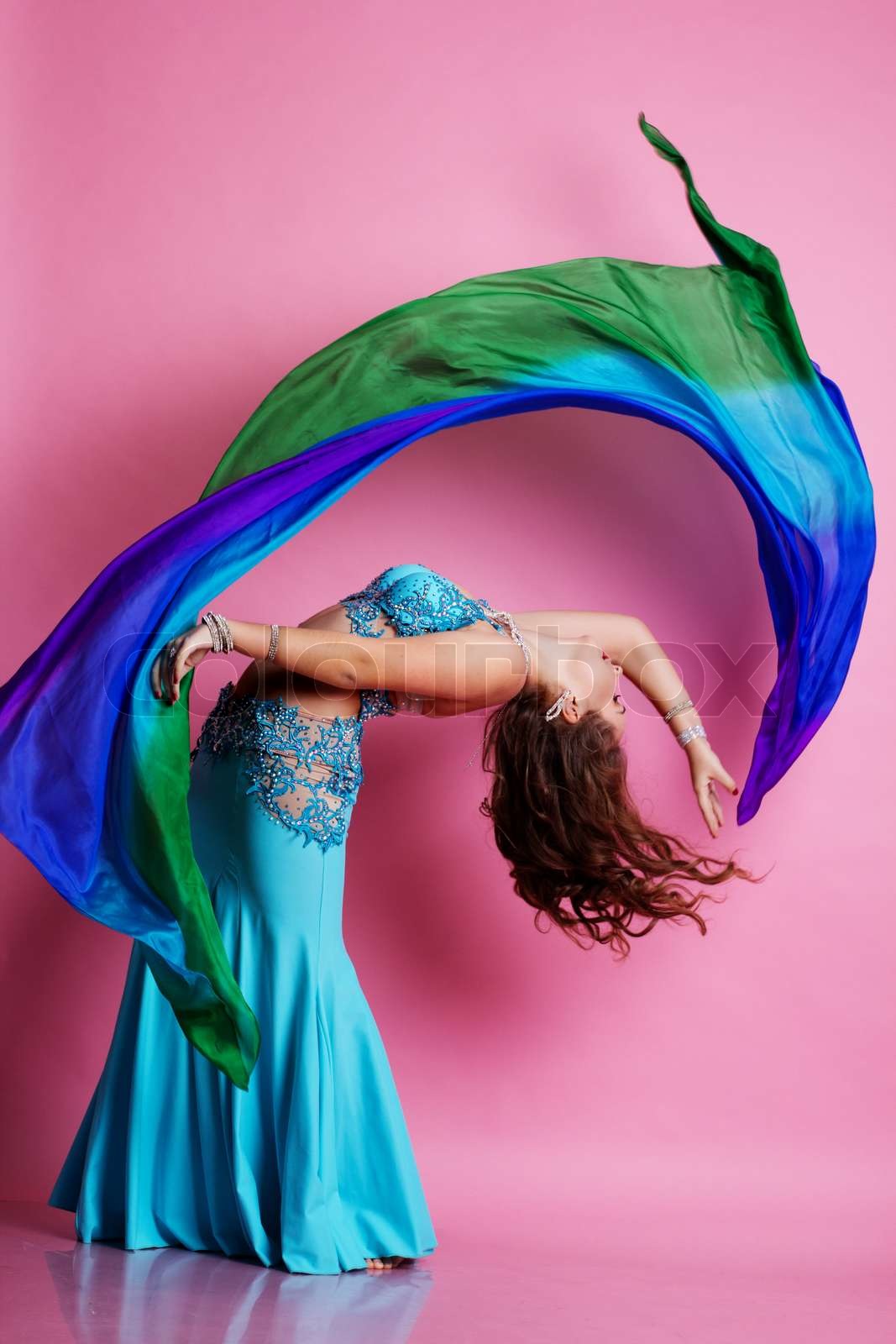 Beautiful belly dancer is wearing a blue costume | Stock image | Colourbox