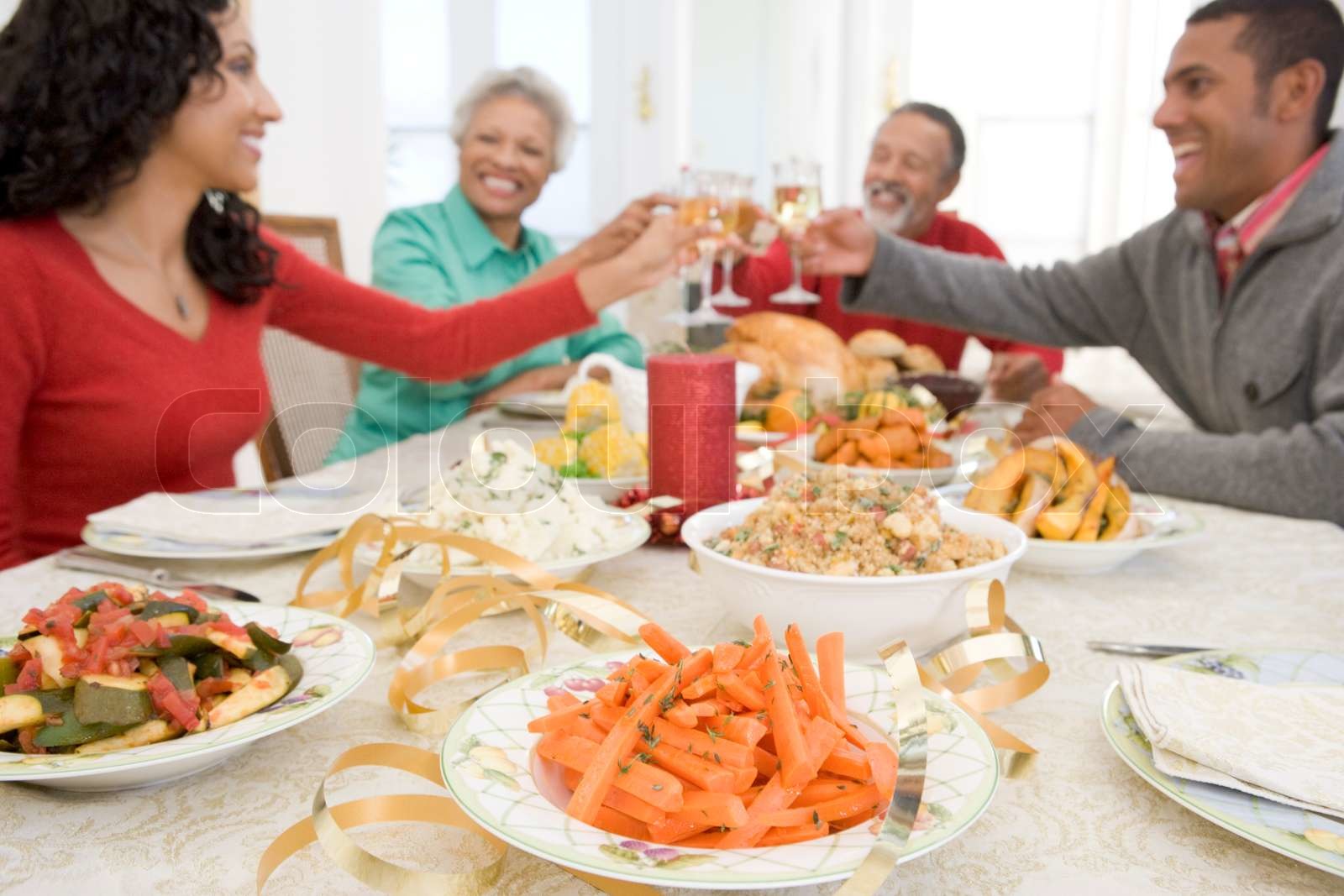 An african-american family enjoying their thanksgiving dinner | Stock