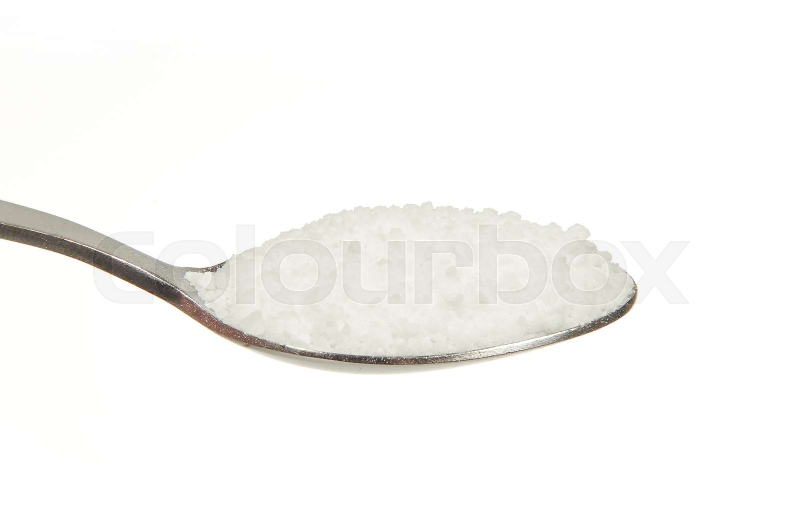 Salt (Sodium chloride) on a teaspoon | Stock image | Colourbox