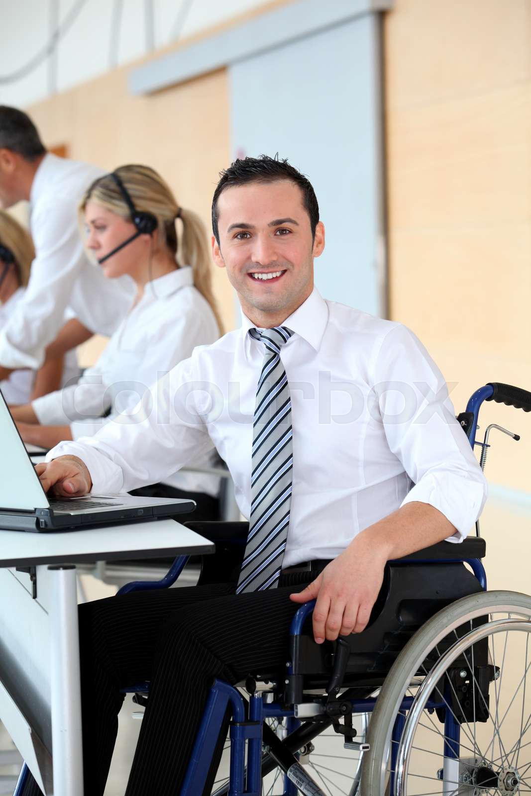 Handicapped office worker Stock image Colourbox