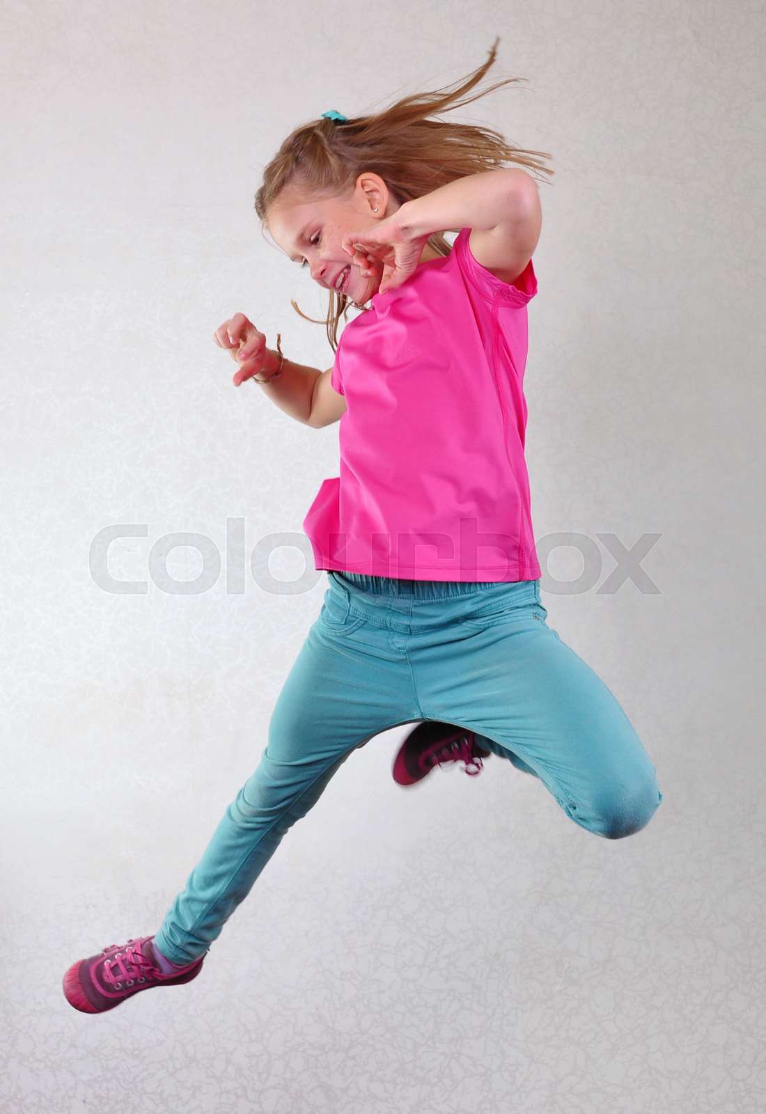 portrait of child jumping and dancing | Stock image | Colourbox
