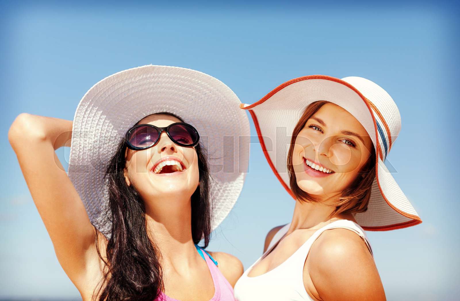 girls in hats on the beach | Stock image | Colourbox