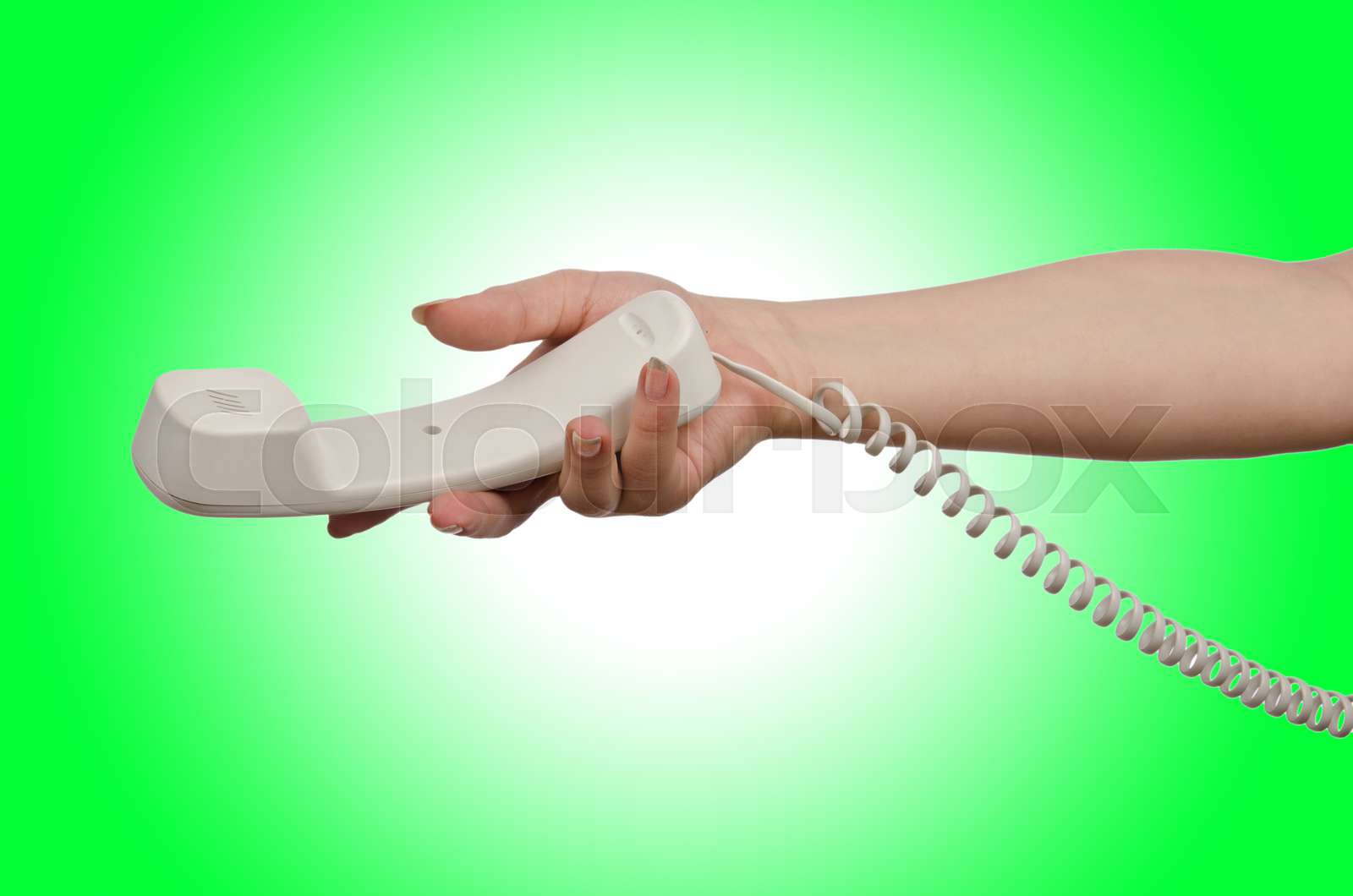 Hand with phone isolated on white | Stock image | Colourbox