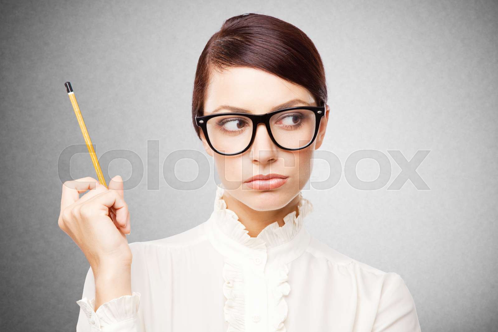 Strict woman in large glasses | Stock image | Colourbox