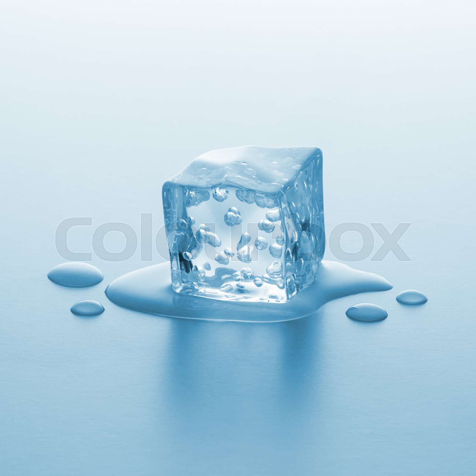melting ice cube with bubbels Stock image Colourbox