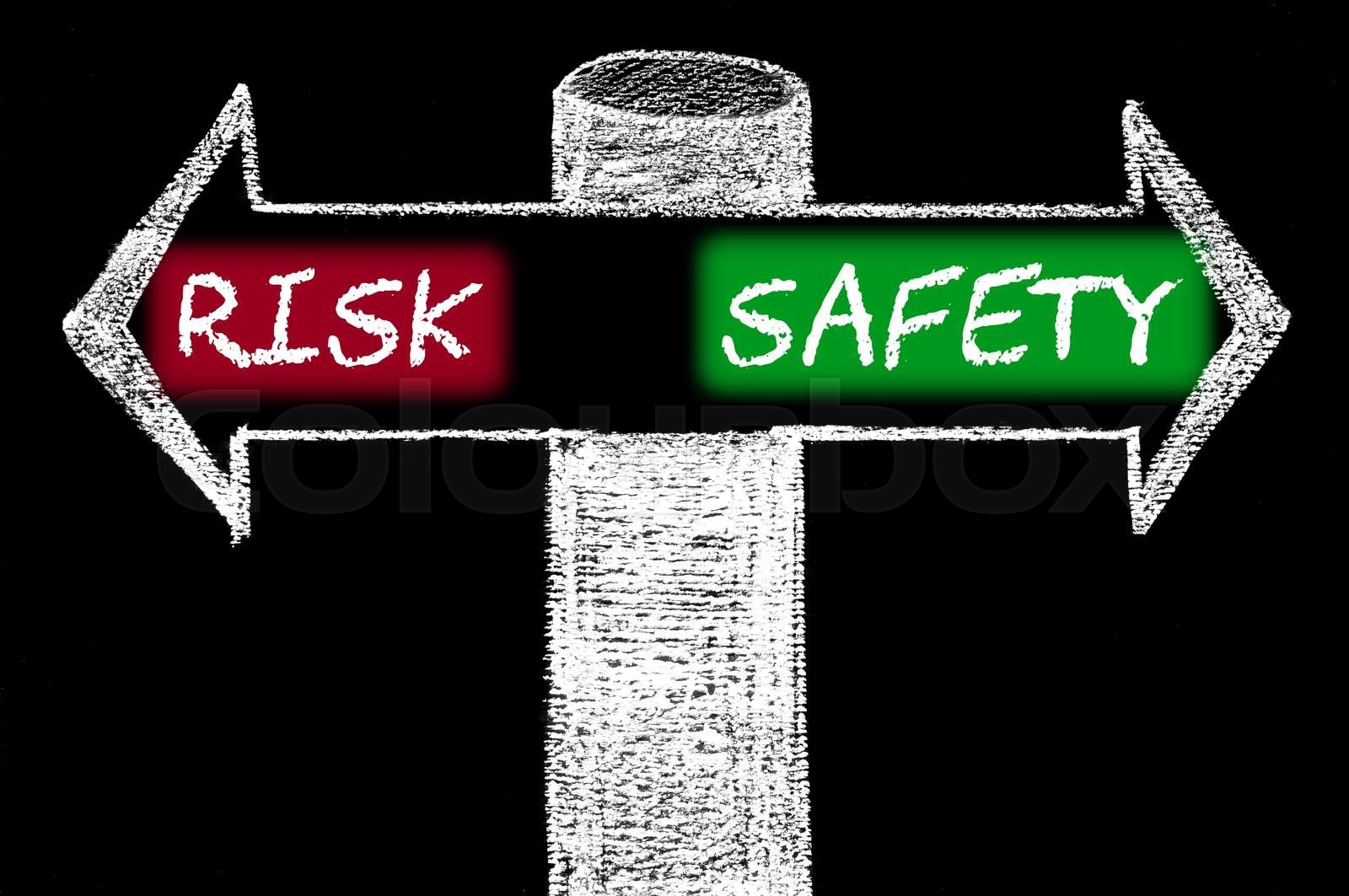 Opposite arrows with Risk versus Safety | Stock image | Colourbox