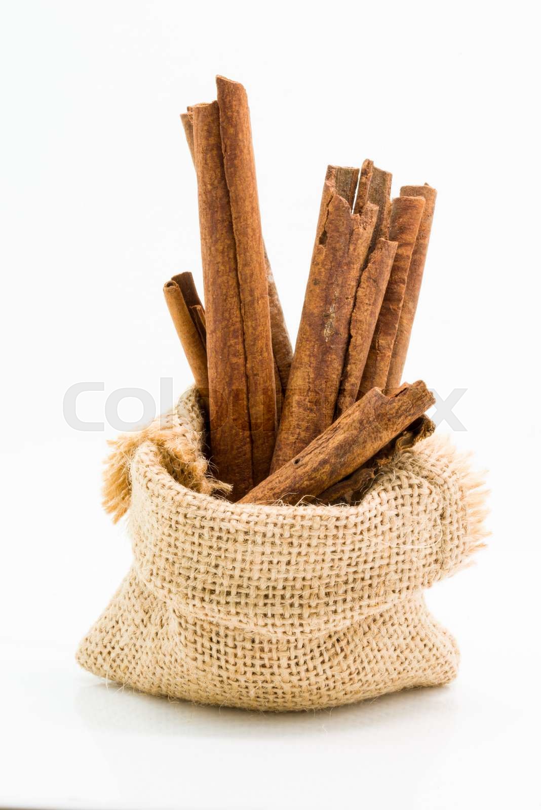 Cinnamon sticks in sack bag stock image colourbox