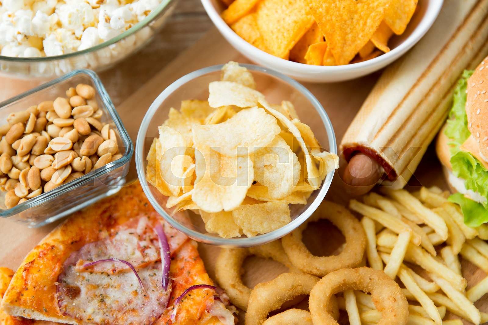 close up of fast food snacks and drink on table Stock image Colourbox