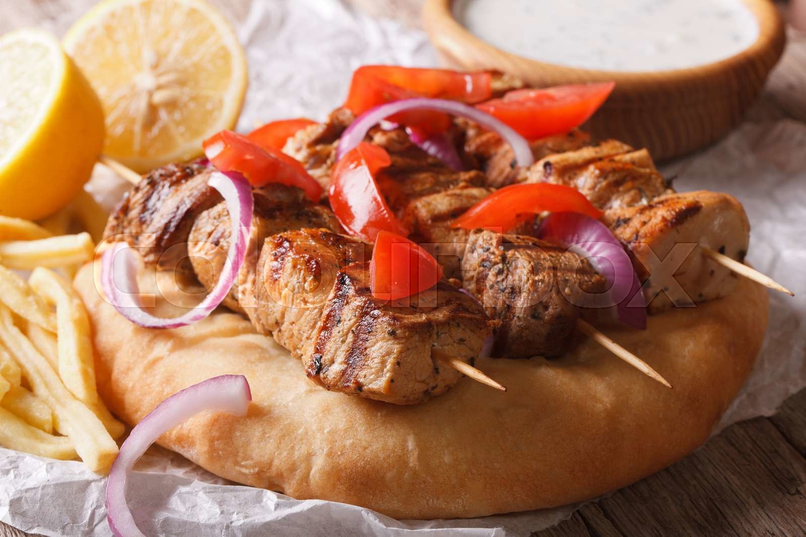 Greek souvlaki kebab with pita bread macro. horizontal Stock image