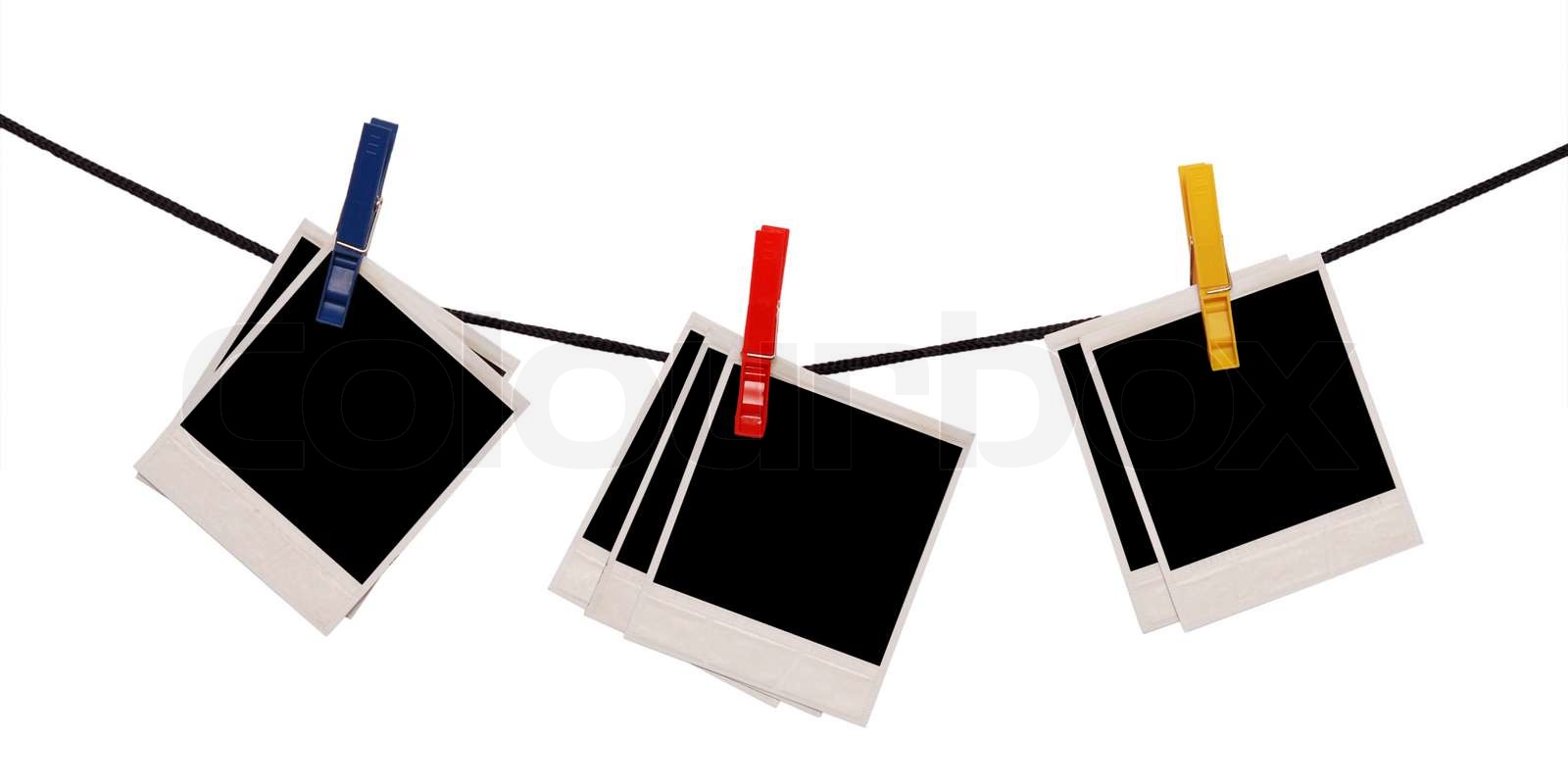 photo frames on a rope isolated on white Stock image Colourbox