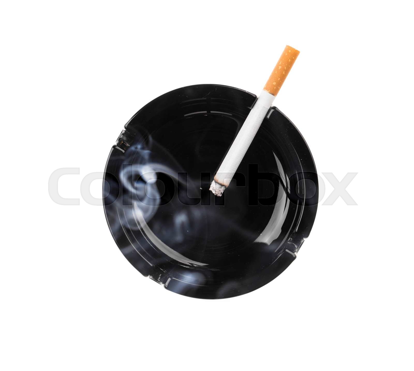 Black ashtray and smoking cigarette. | Stock image | Colourbox