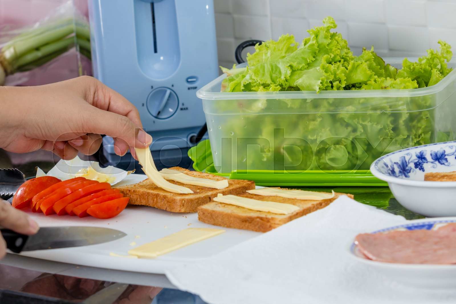 Making a sandwich Stock image Colourbox