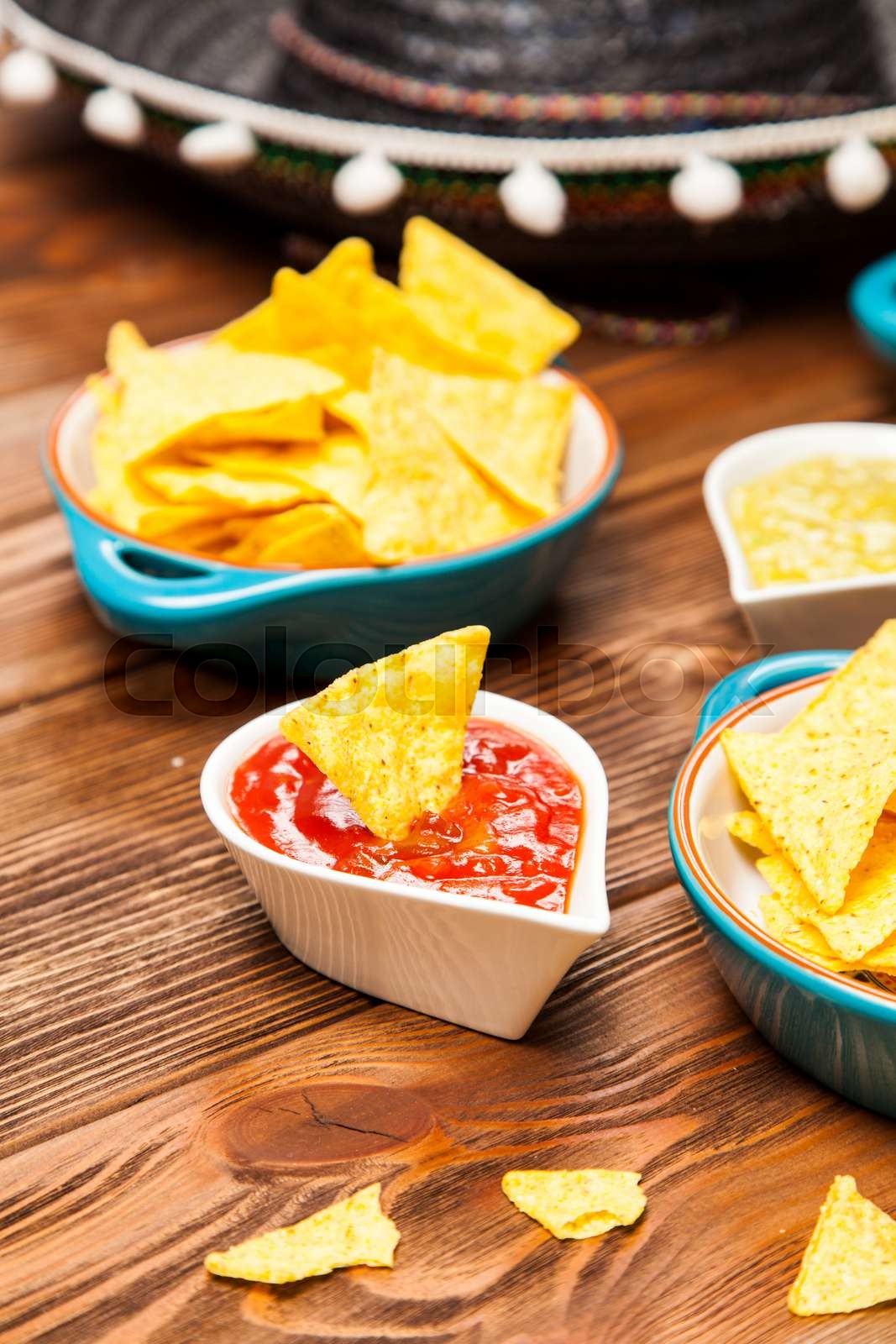 plate-of-nachos-with-different-dips-stock-image-colourbox