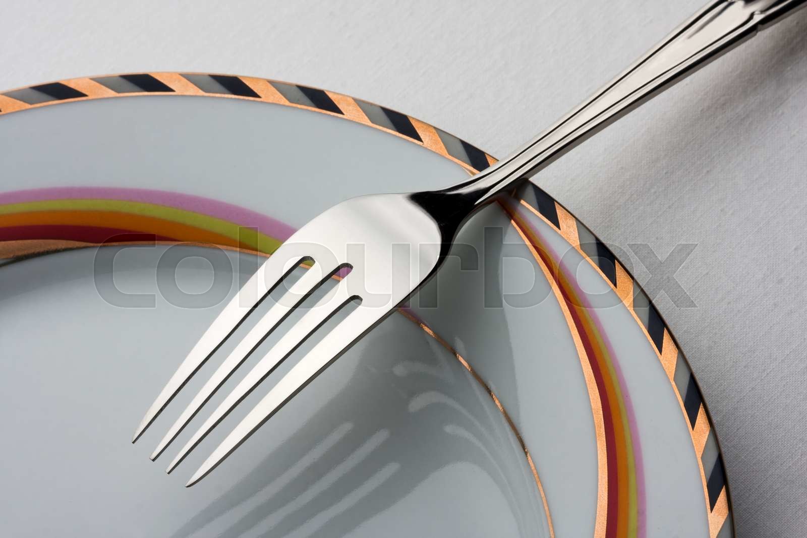 Fork on plate | Stock image | Colourbox