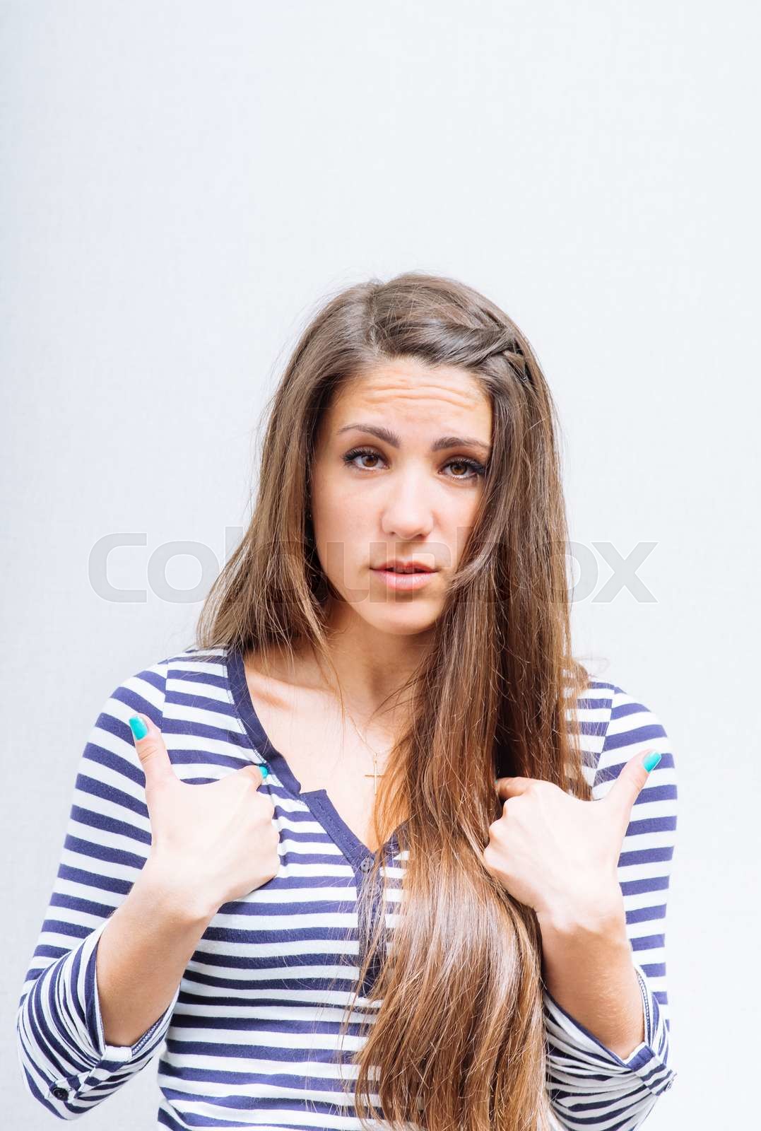 The woman in question point the index fingers on his chest stock