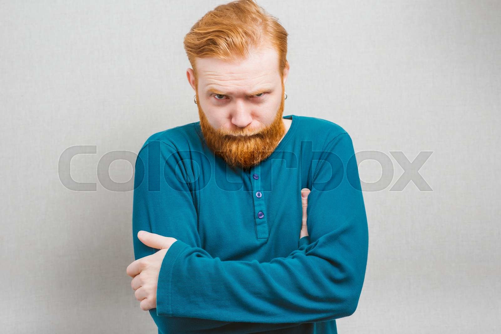 Sulking man crossing his arms | Stock image | Colourbox