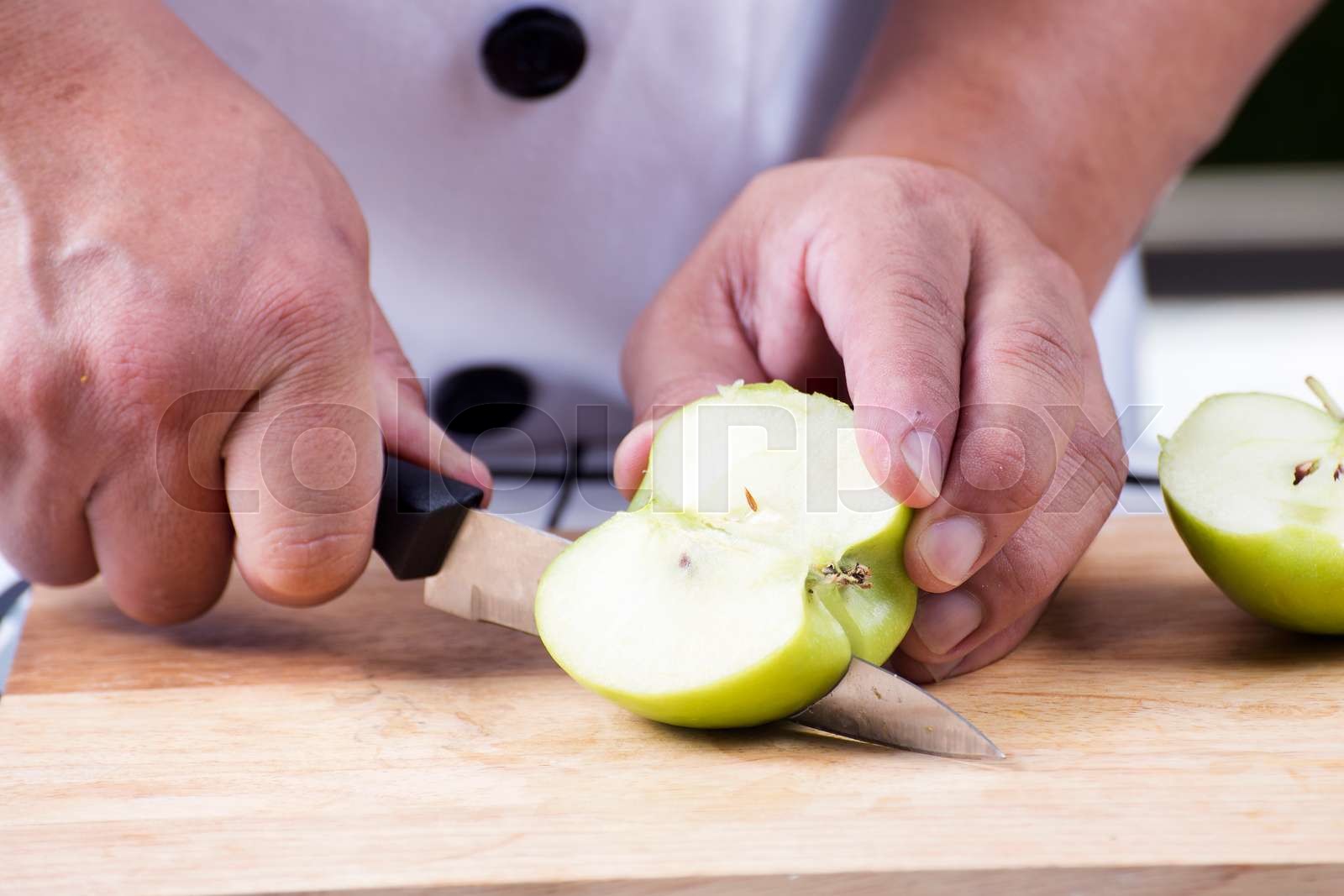 cutting green apple | Stock image | Colourbox