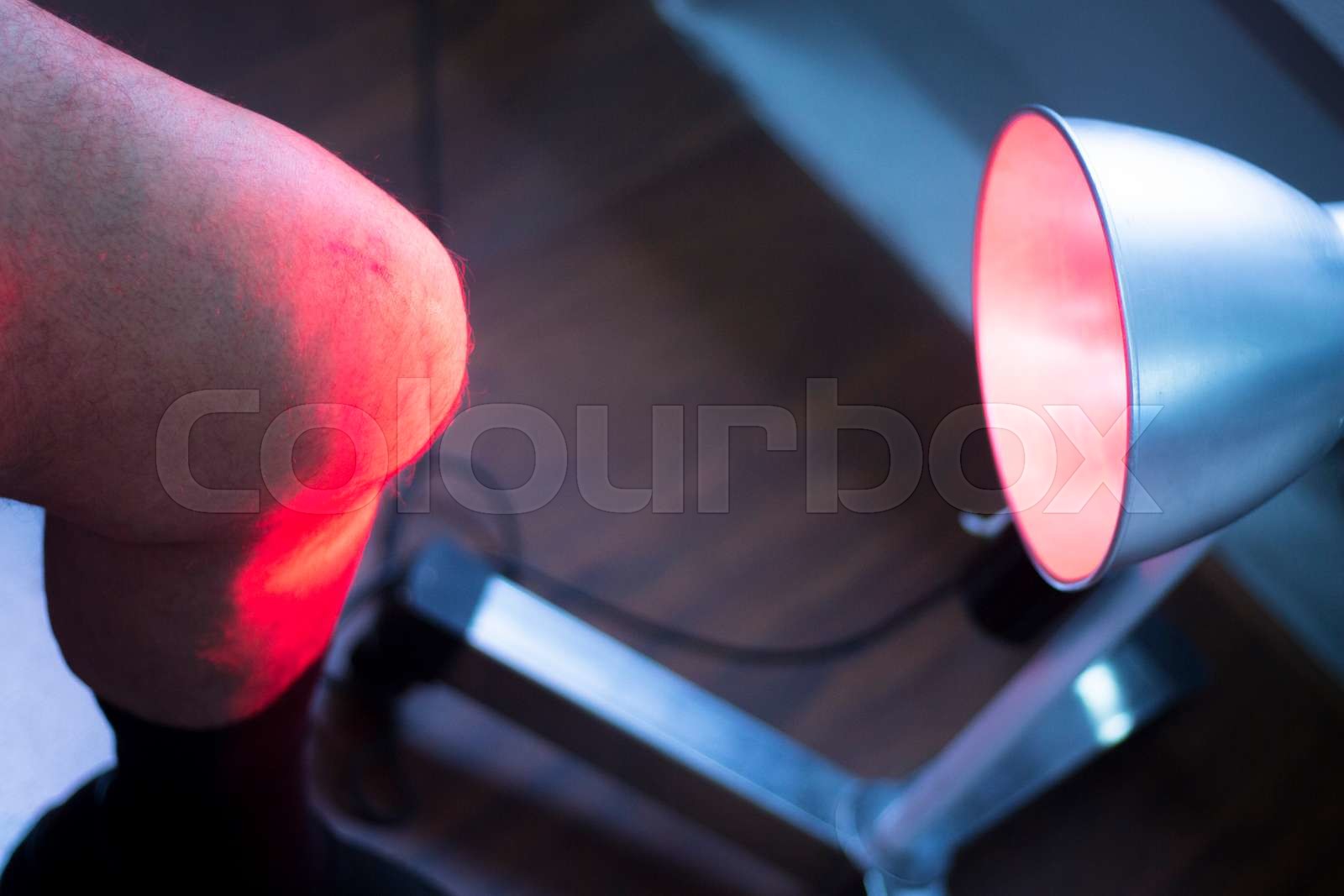Physiotherapy clinic patient in heat treatment Stock image Colourbox