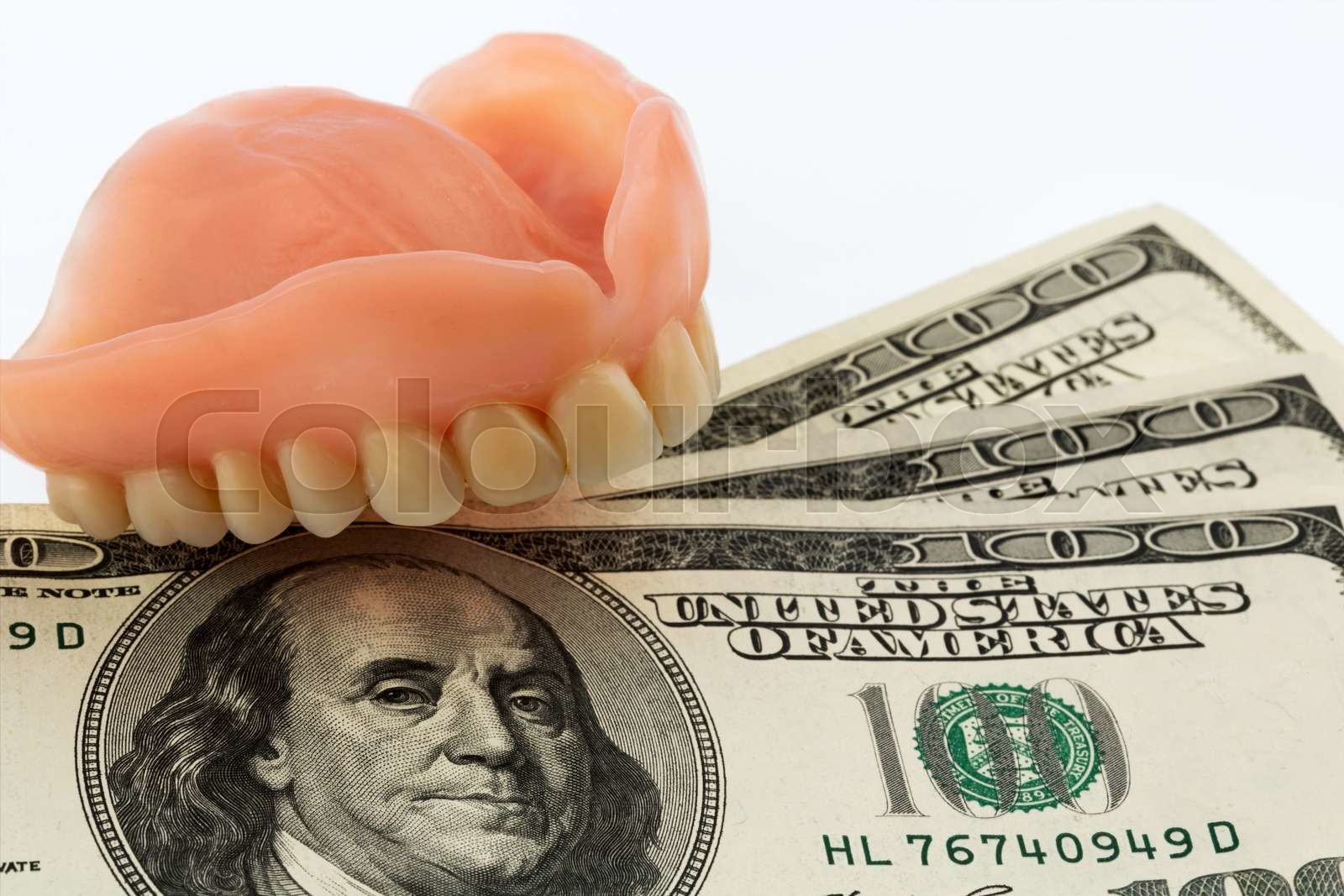 dentures and dollar bills Stock image Colourbox