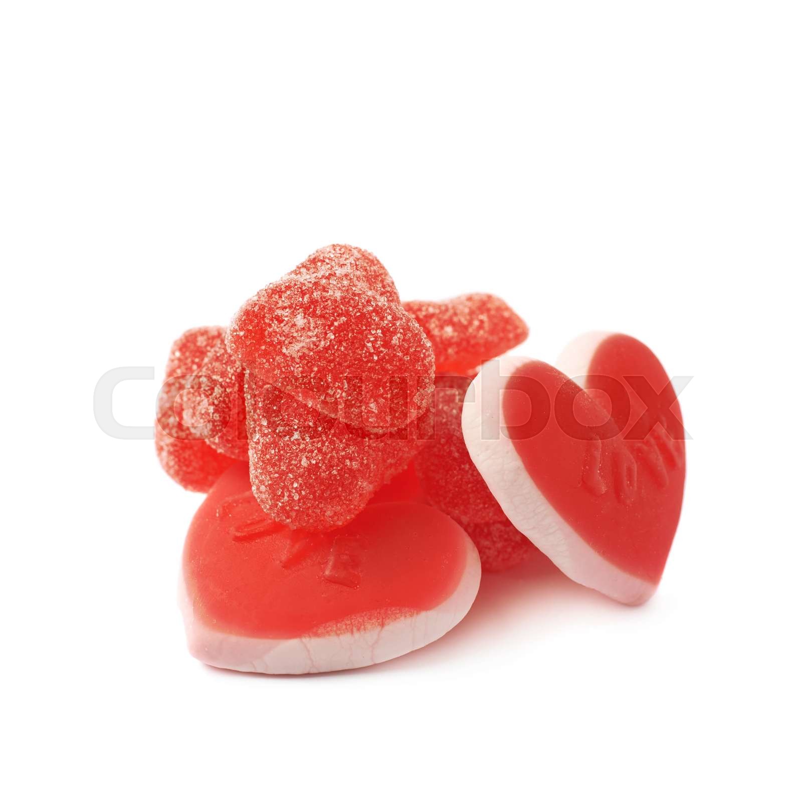 Pile of red candies isolated Stock image Colourbox