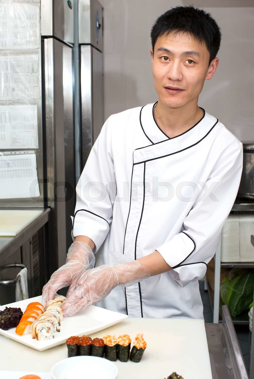 Japanese chef preparing a meal in a restaurant | Stock image | Colourbox