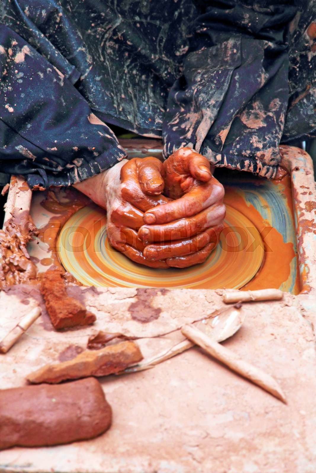 Potter hands. Stock image Colourbox