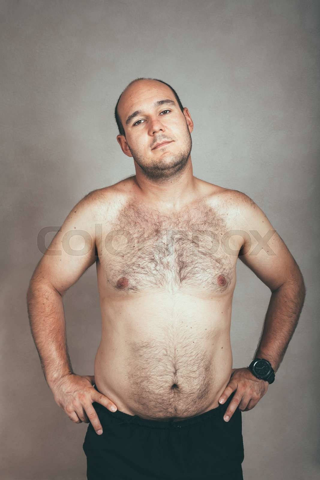 Corpulent hairy shirtless man Stock image Colourbox