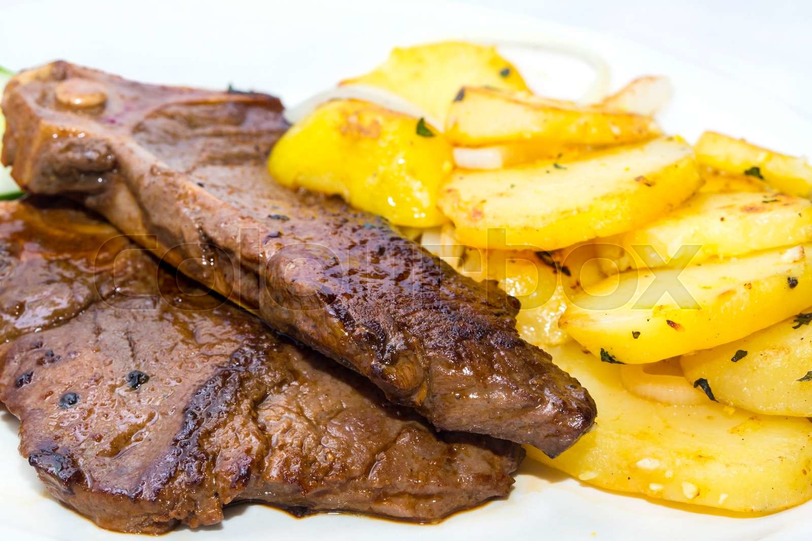 T Bone steak with potatoes and vegetables Stock image Colourbox